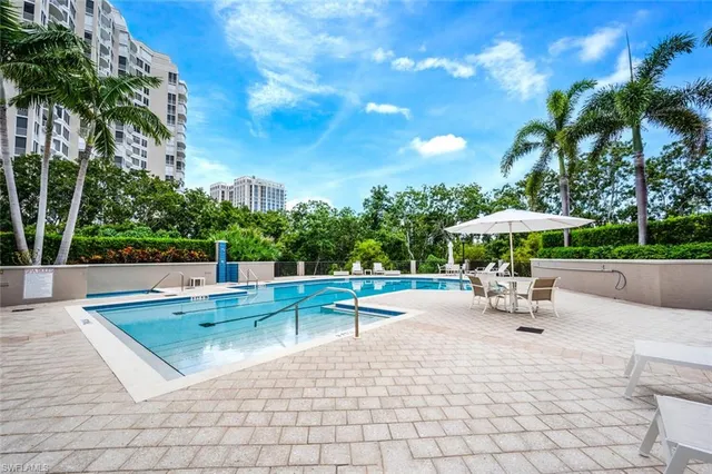 a view of a swimming pool with a patio