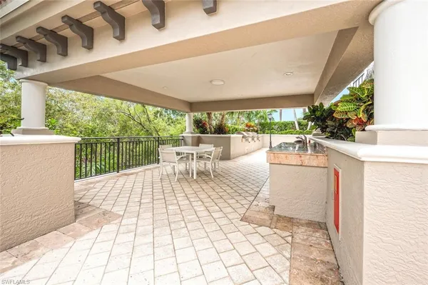 a view of balcony with wooden floor and fence
