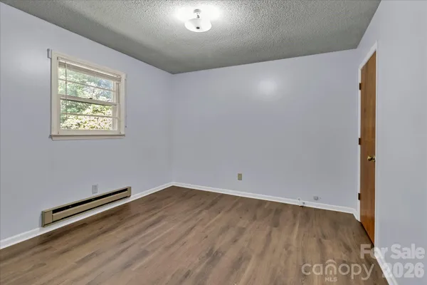 an empty room with a bench