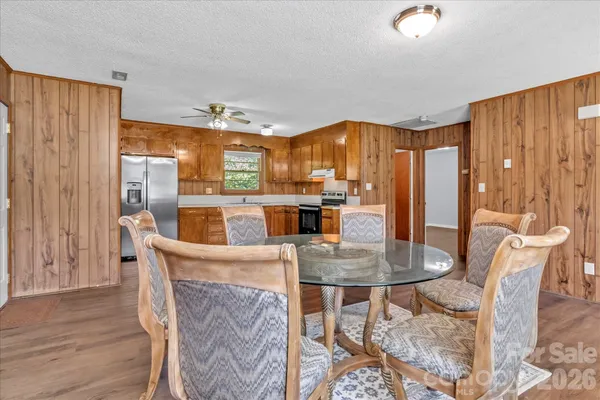 a view of a dining room with furniture window and wooden floor