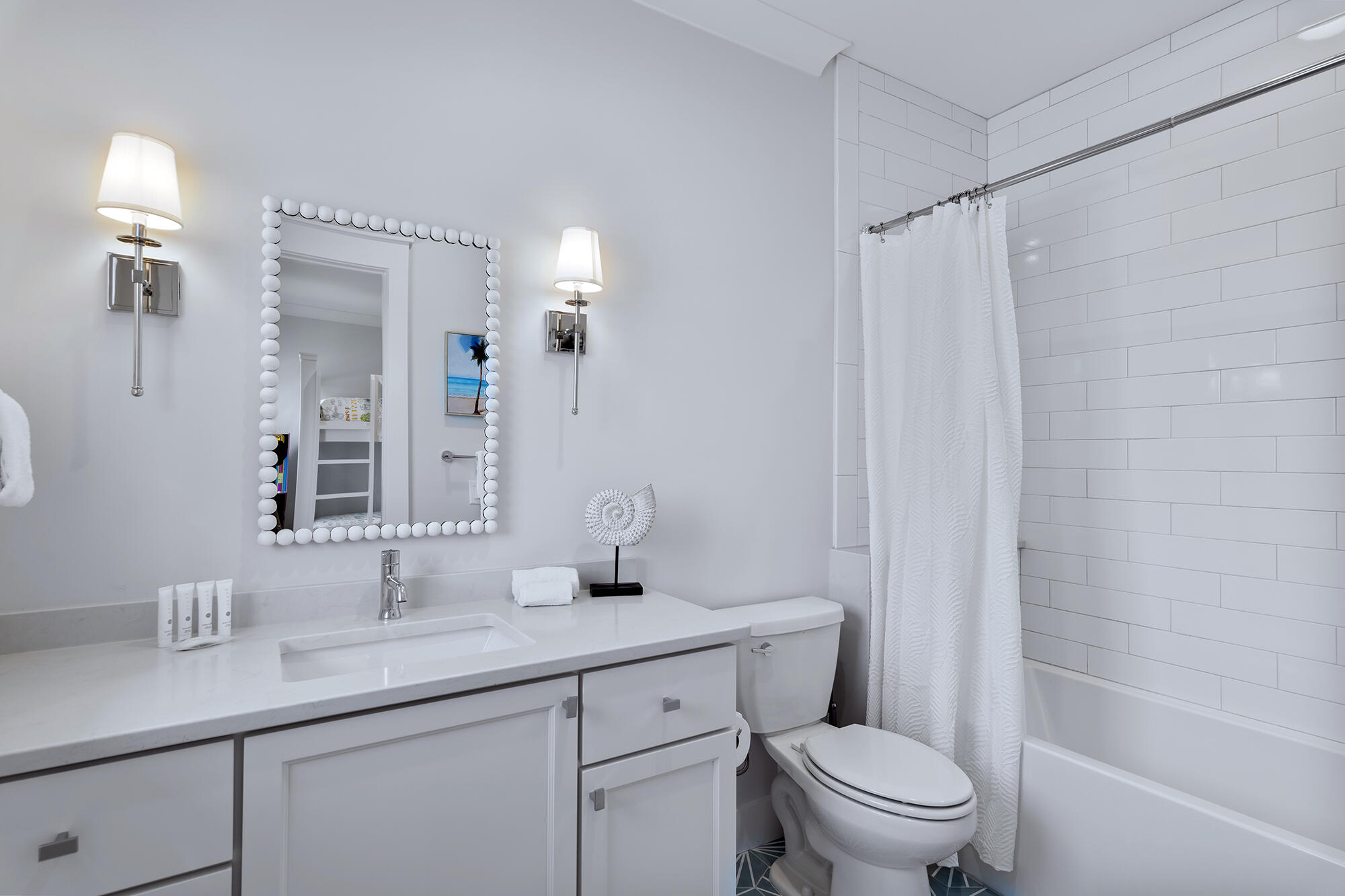 512 Defuniak Street Santa Rosa Beach, FL 32459 - Photo 44 of 44 a bathroom with a sink a toilet a mirror a vanity and shower