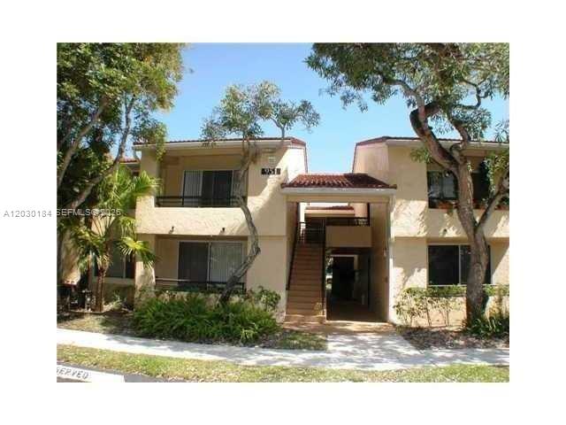 951 Lyons Road, Unit 6104 Coconut Creek, FL 33063 - Photo 1 of 18 a front view of a house with a yard