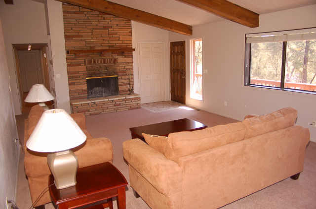 813 South Sutton Road Payson, AZ 85541 - Photo 2 of 6 a bedroom with a bed and a fireplace