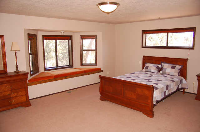 813 South Sutton Road Payson, AZ 85541 - Photo 4 of 6 a spacious bedroom with a bed and window