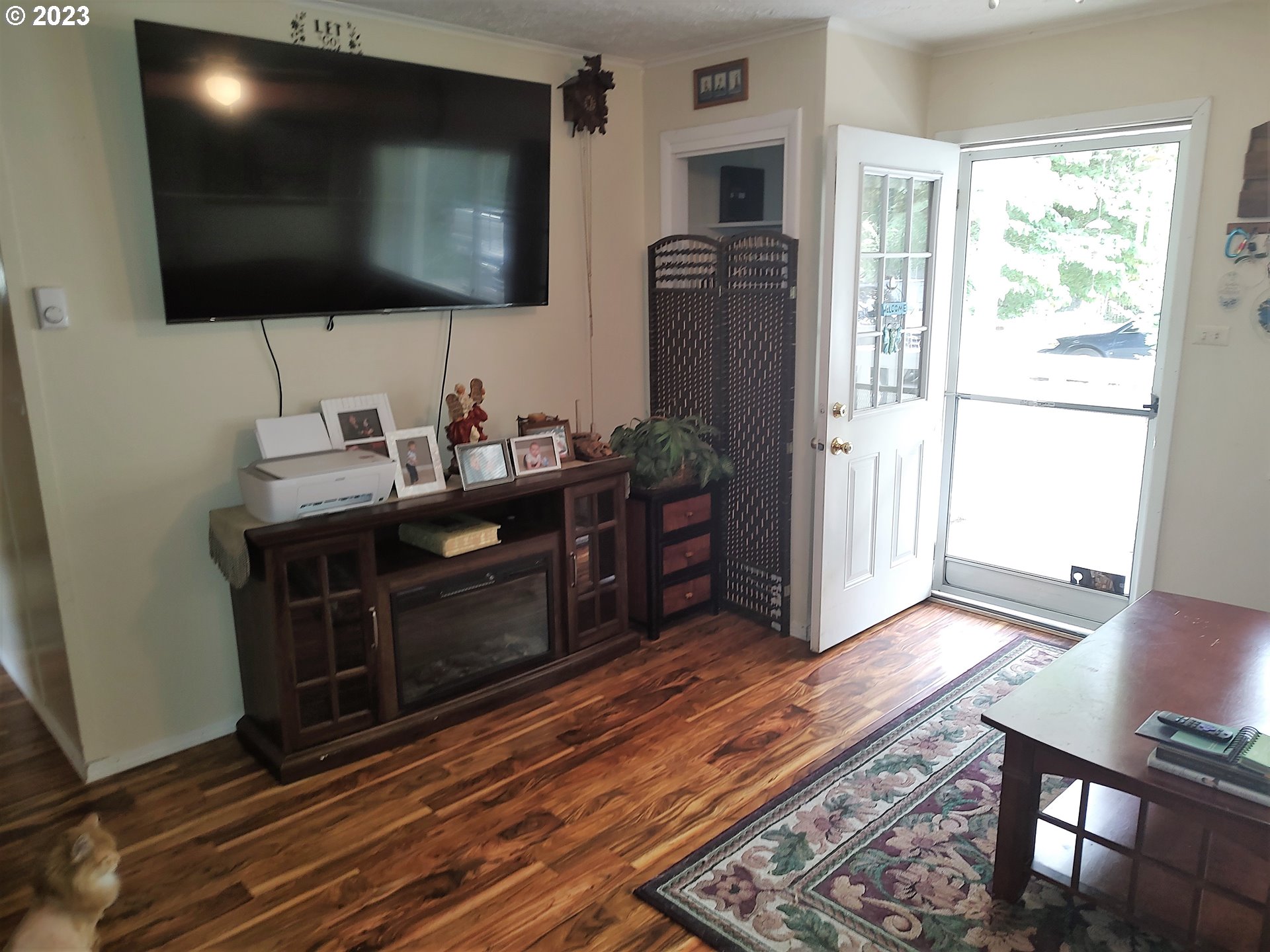 306 Southeast 4th Street Battle Ground, WA 98604 - Photo 3 of 23 a living room with furniture and a flat screen tv