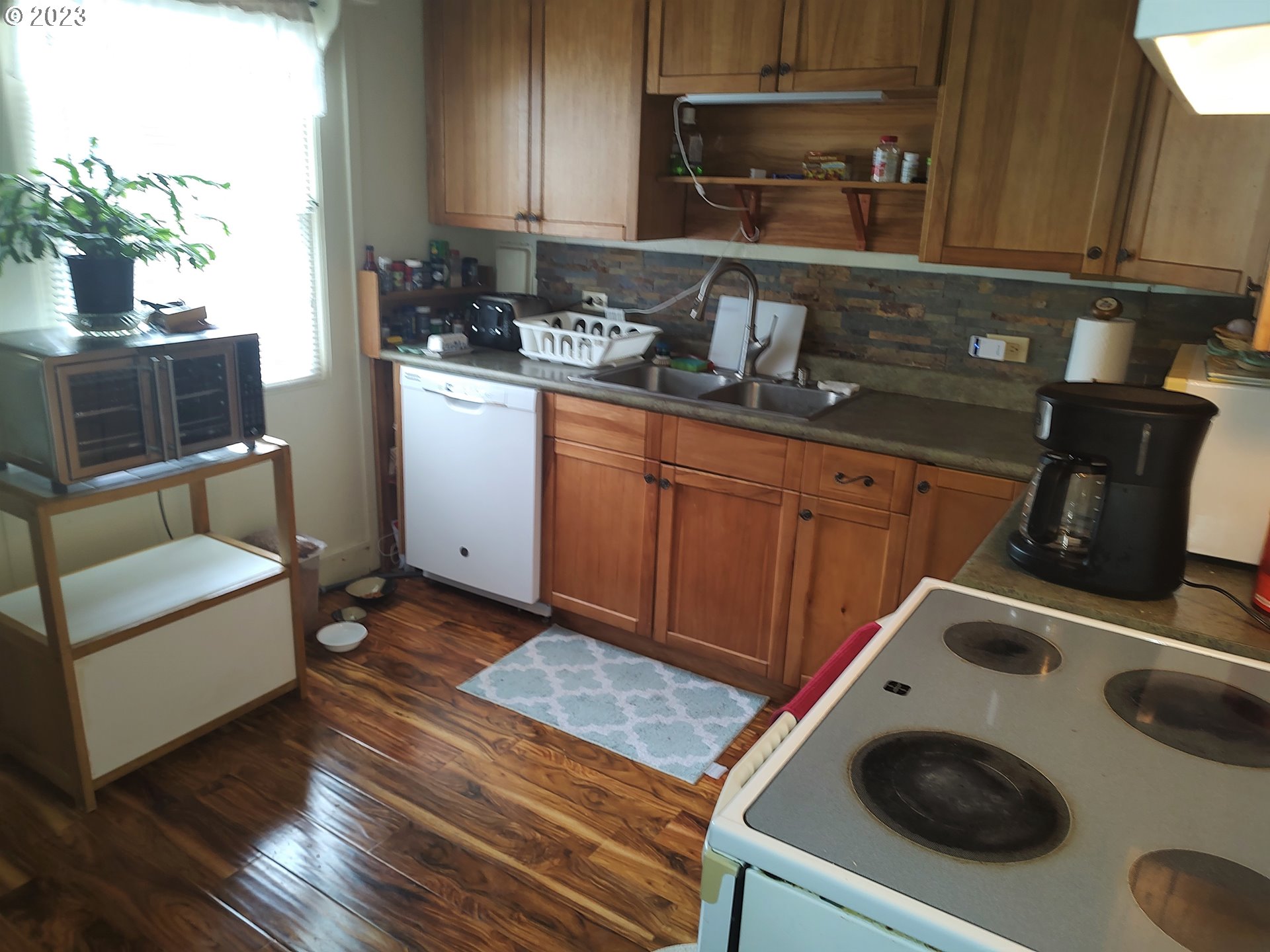 306 Southeast 4th Street Battle Ground, WA 98604 - Photo 6 of 23 a kitchen with sink and cabinets