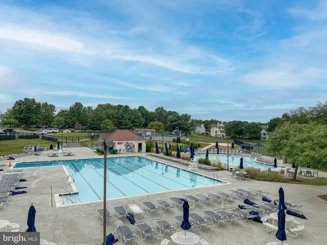 a view of a swimming pool with a patio