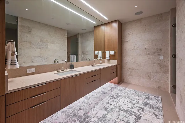 a bathroom with a sink double vanity and a mirror
