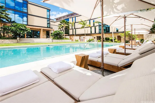 a view of a swimming pool with a patio