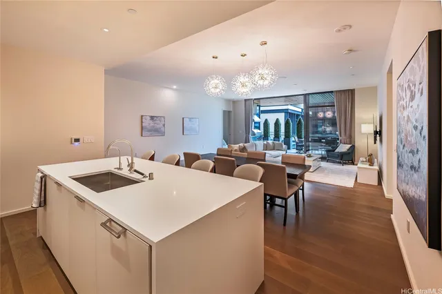 a view of kitchen island a sink and living room