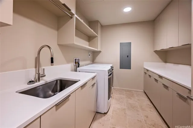 a kitchen with a sink and a stove top oven