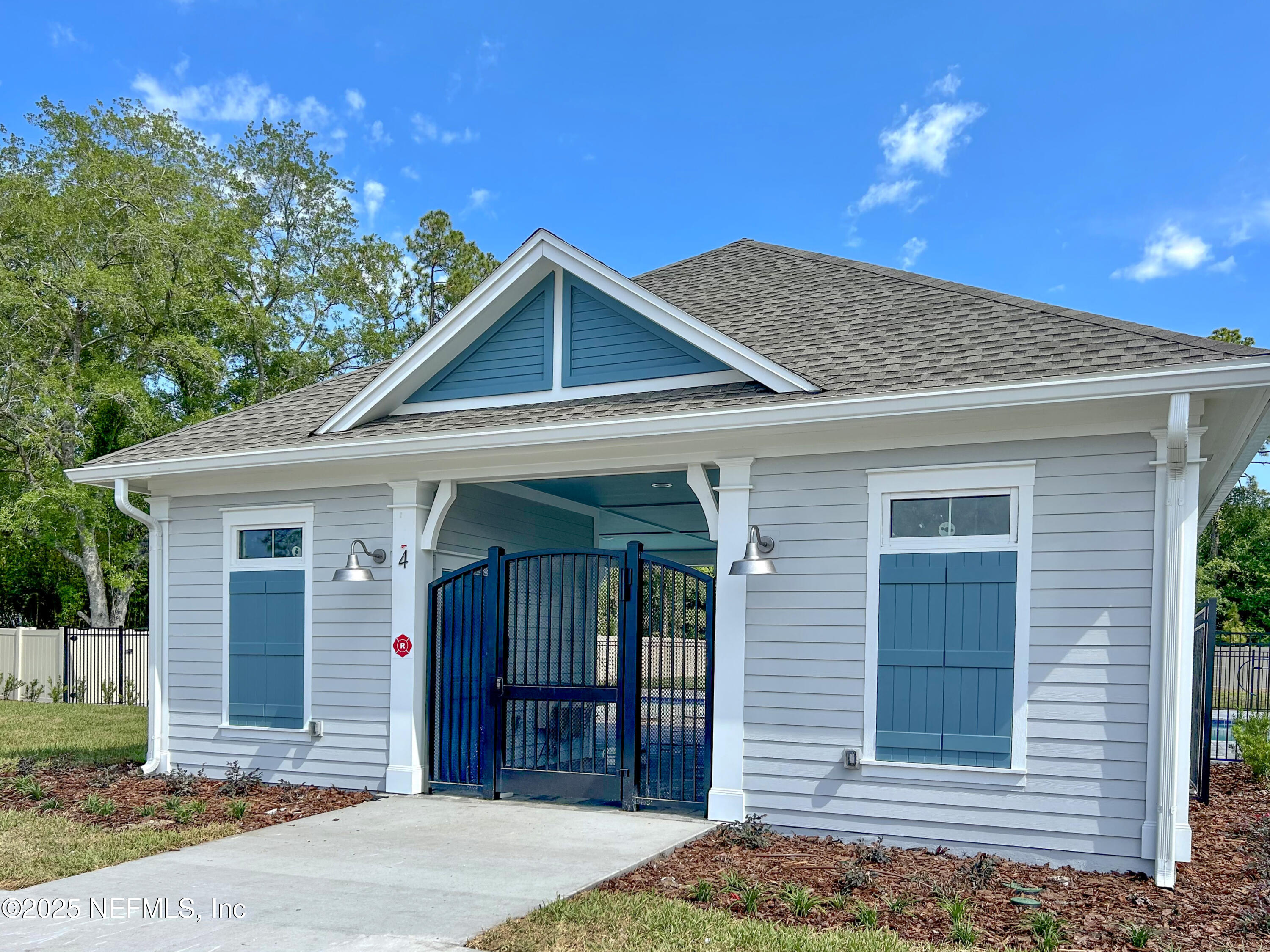 77 River Strand Lane St. Augustine, FL 32084 - Photo 24 of 24 a front view of a house with a yard