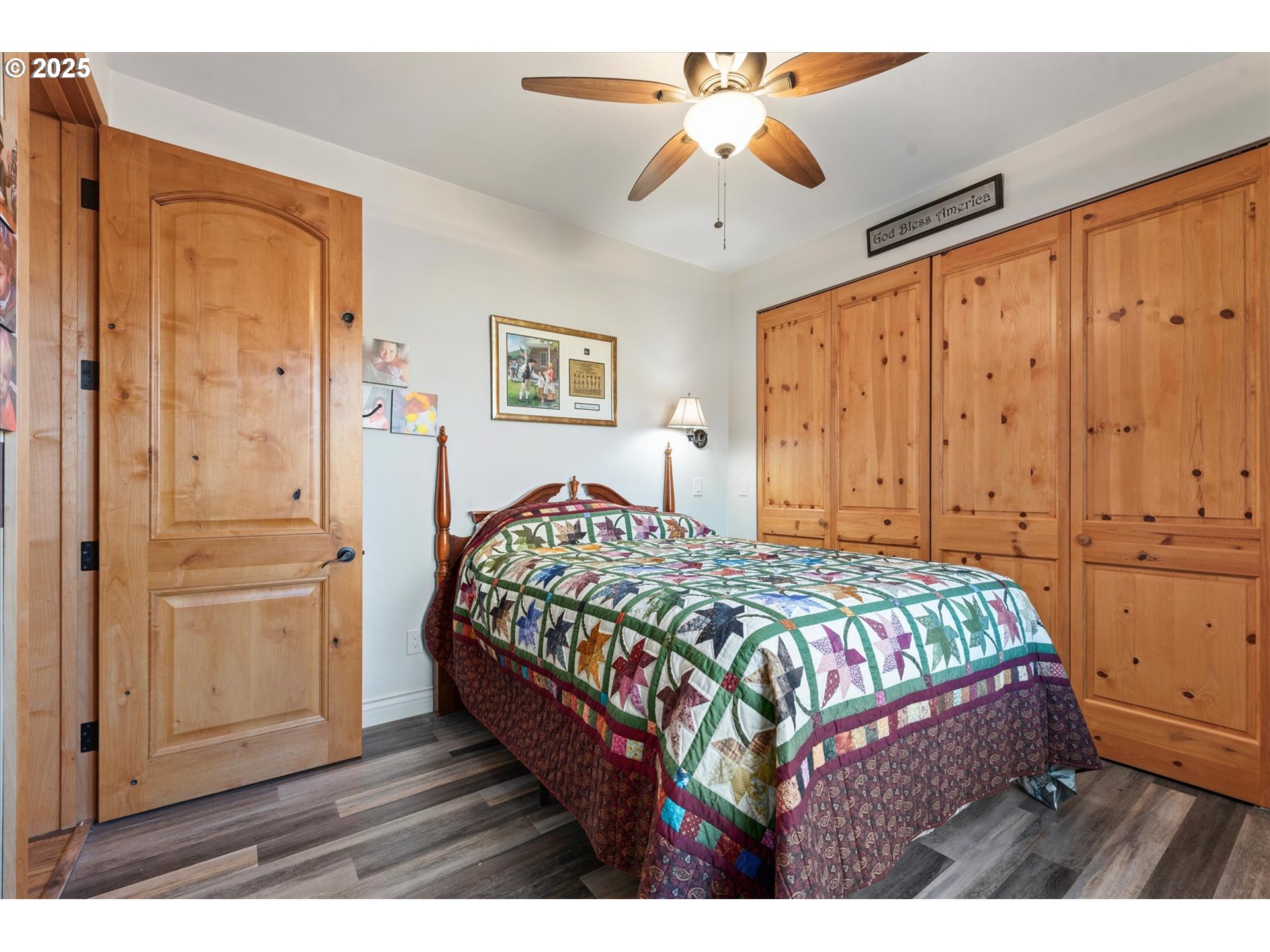 42759 Moody Road Richland, OR 97870 - Photo 16 of 27 a bedroom with a bed and a chandelier