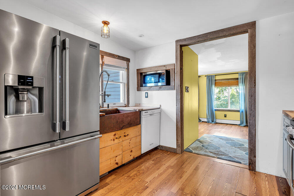 105 Longfellow Avenue Toms River, NJ 08753 - Photo 12 of 38 a kitchen with stainless steel appliances granite countertop a refrigerator and a stove