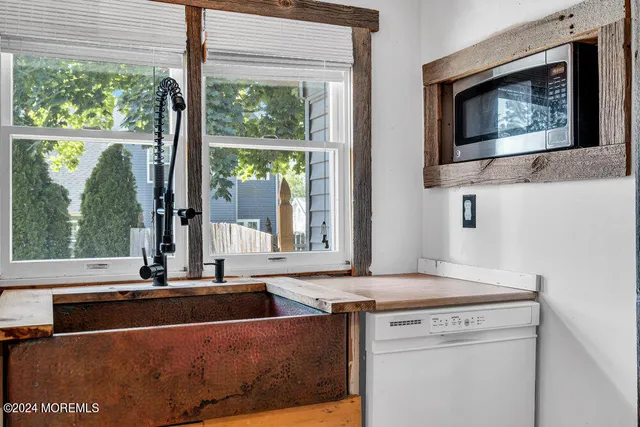 a kitchen with a stove and a sink
