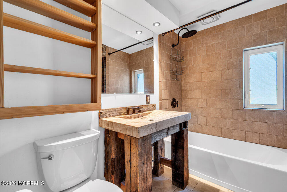 105 Longfellow Avenue Toms River, NJ 08753 - Photo 24 of 38 a bathroom with a sink and a bathtub