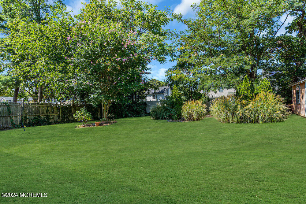 105 Longfellow Avenue Toms River, NJ 08753 - Photo 28 of 38 a view of a grassy field with trees