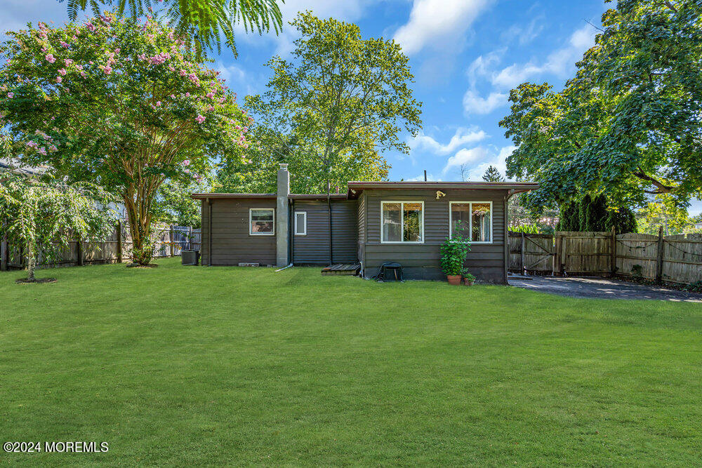 105 Longfellow Avenue Toms River, NJ 08753 - Photo 30 of 38 a view of a house with a yard and sitting area