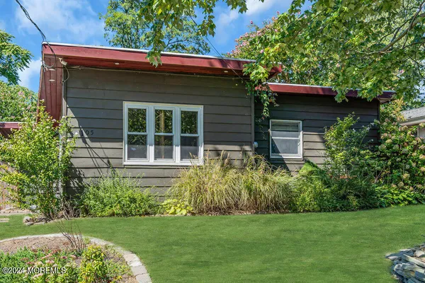 a view of a house with a garden