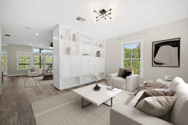 a living room with furniture and a large window