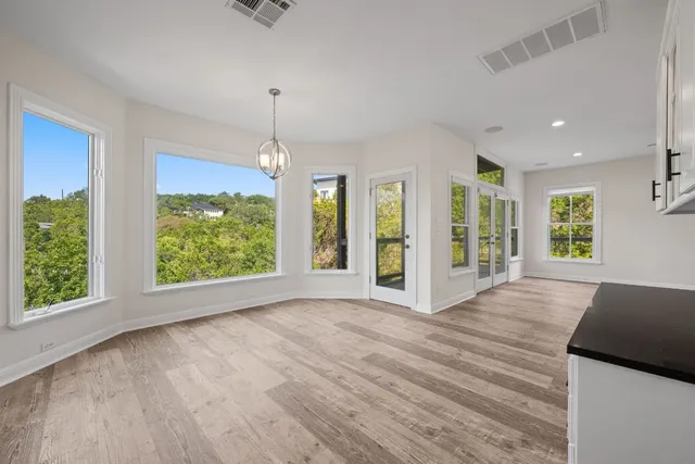 a kitchen with kitchen island a stove a sink and a refrigerator