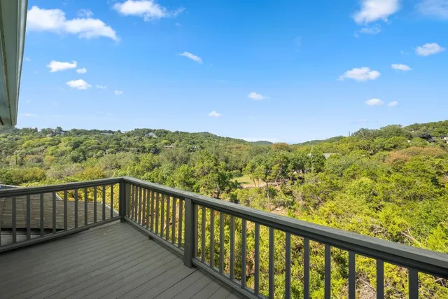 a view of a balcony with an outdoor space