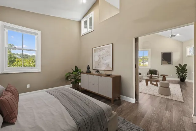 a bathroom with a granite countertop sink a mirror and shower