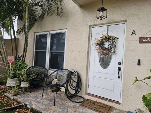 a view of a entryway with furniture and front door