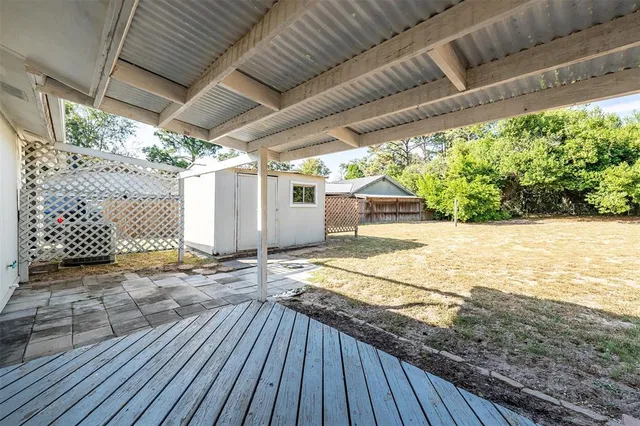 a view of outdoor space with wooden floor