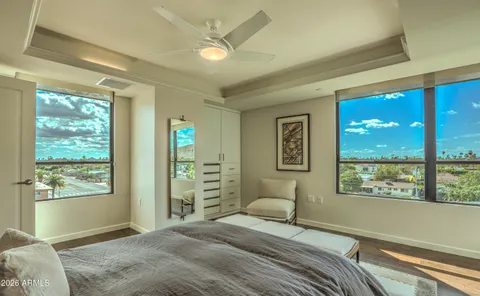 a bed room with a bed and a window