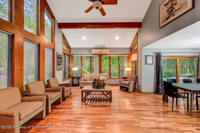 a view of a dining room with furniture window and wooden floor