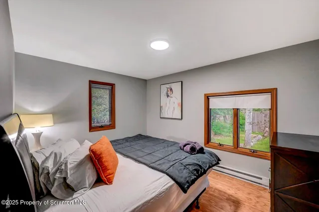 a bedroom with double bed and a night stand