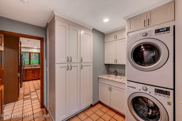 a bathroom with a sink a vanity and a mirror