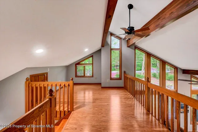 a bathroom with a granite countertop sink a mirror and a bathtub