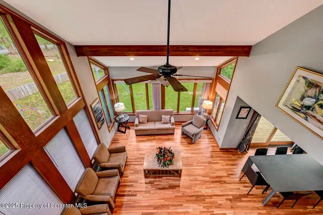 a spacious bathroom with a granite countertop sink a mirror and a toilet