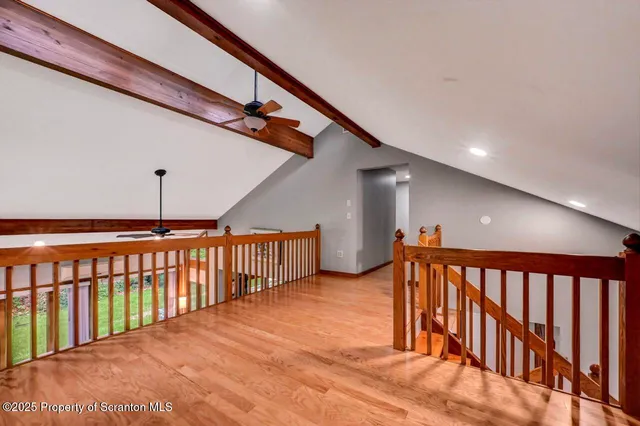 a bedroom with a bed and a lamp on table