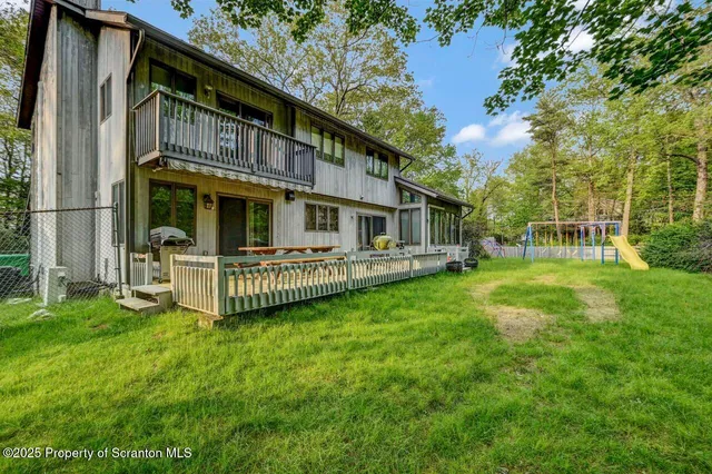 a view of an entryway with wooden floor and door