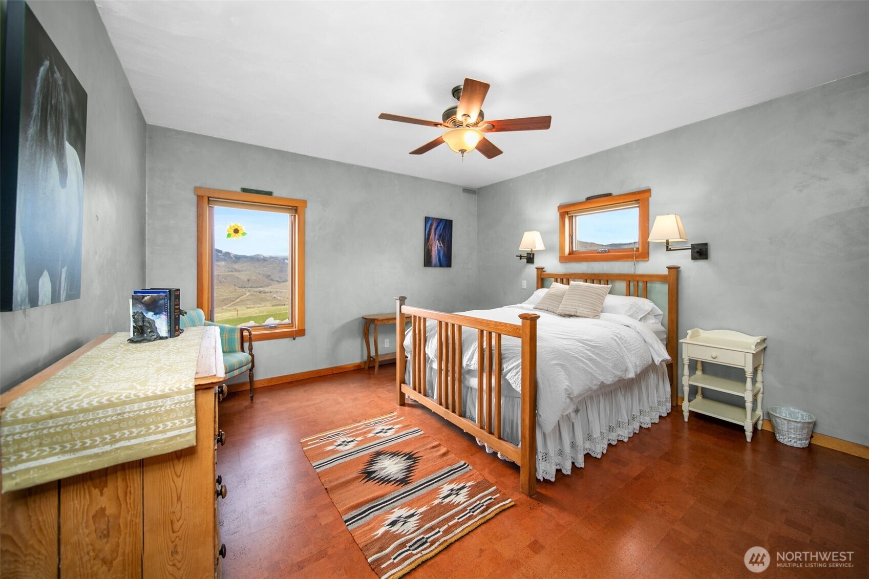 74 Sawtooth View Road Pateros, WA 98846 - Photo 17 of 30 a bedroom with a bed and a chandelier
