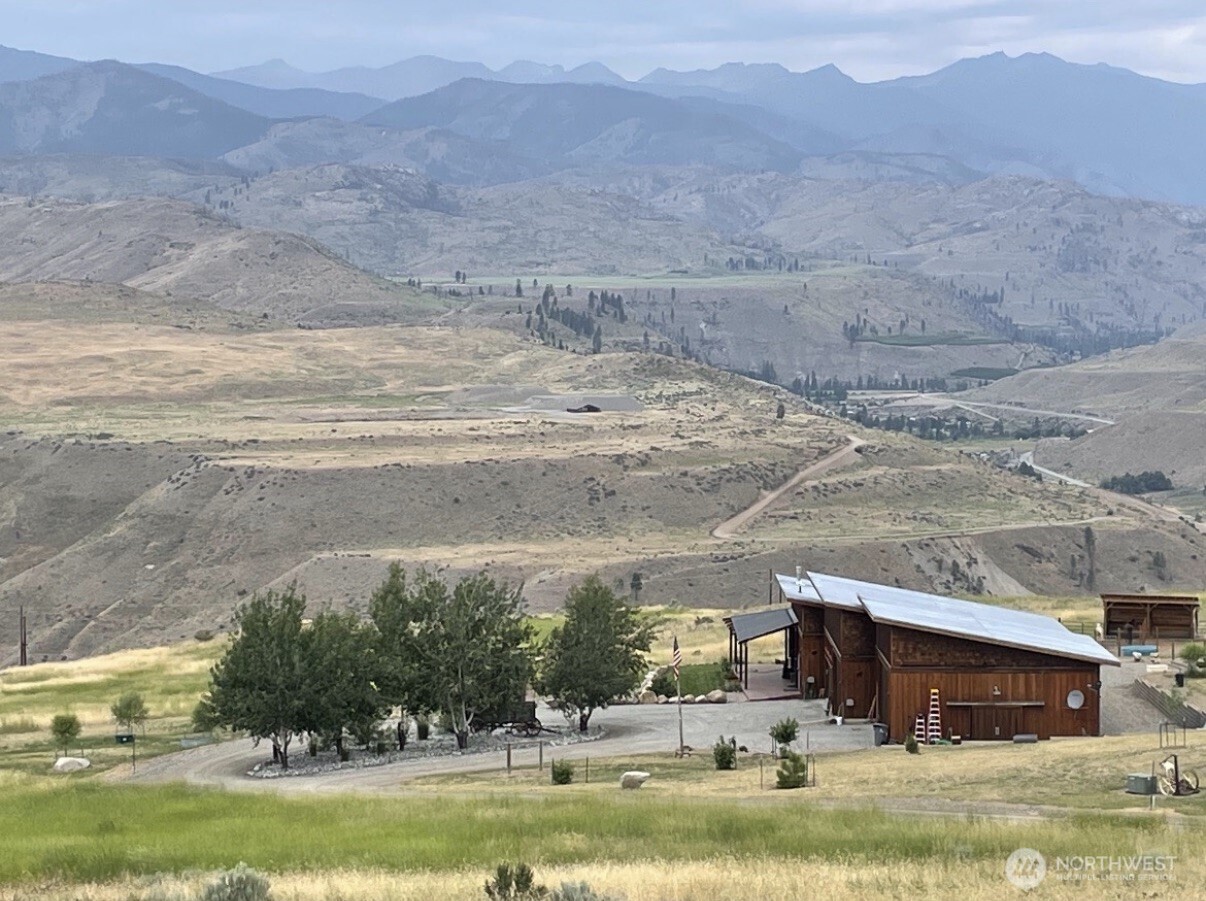 74 Sawtooth View Road Pateros, WA 98846 - Photo 2 of 30 a view of a town with mountains in the background