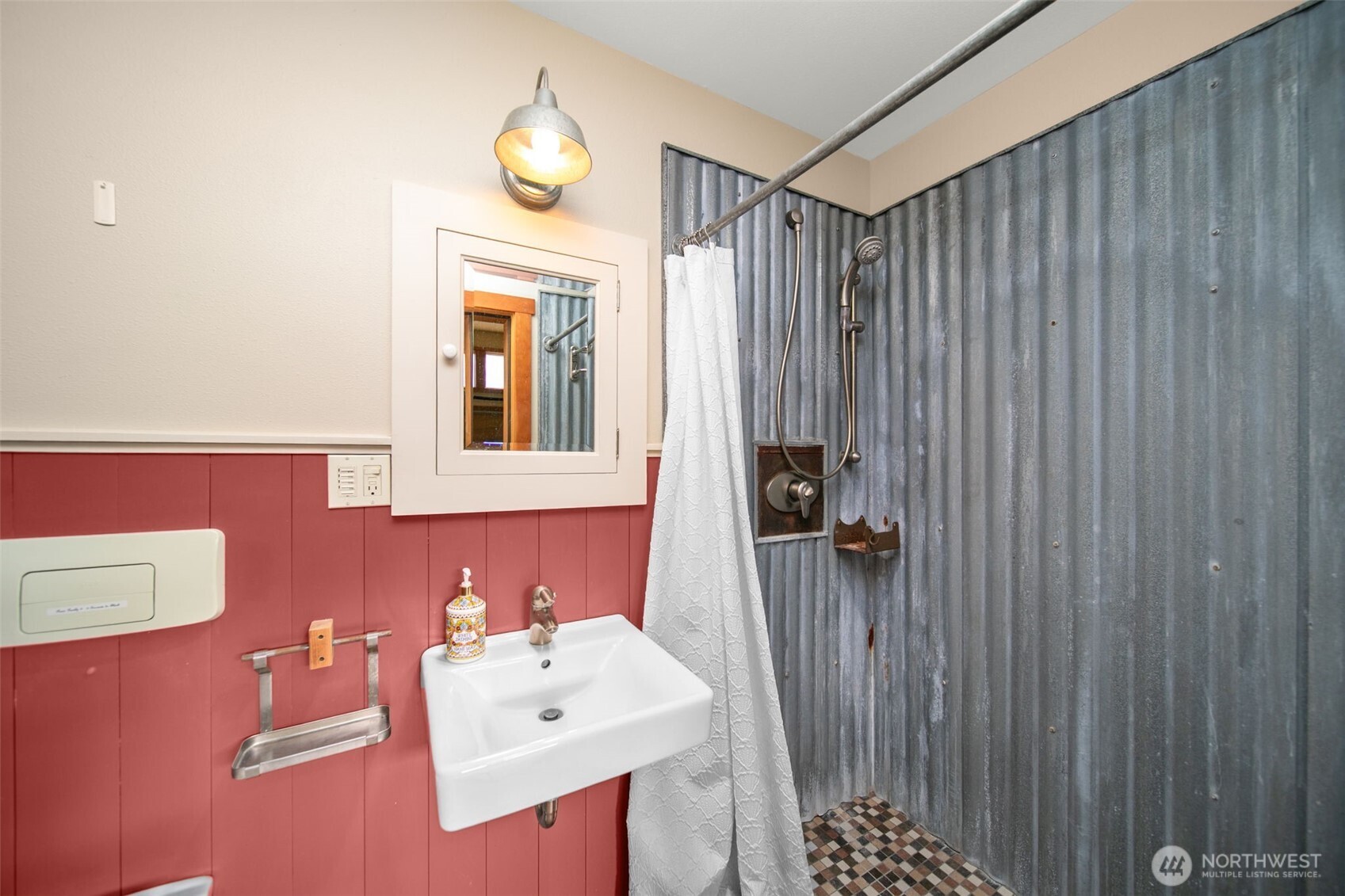 74 Sawtooth View Road Pateros, WA 98846 - Photo 24 of 30 a bathroom with a sink a toilet and shower curtain