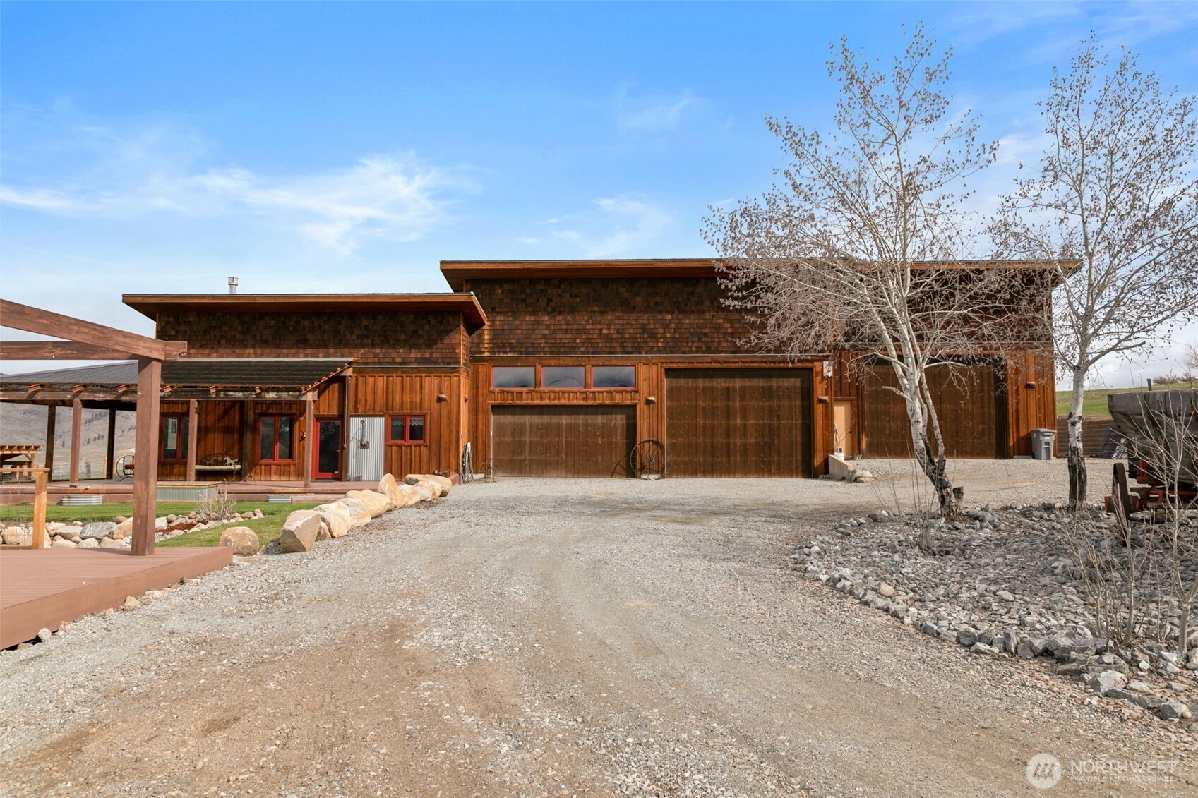 74 Sawtooth View Road Pateros, WA 98846 - Photo 3 of 30 a front view of a building with a yard