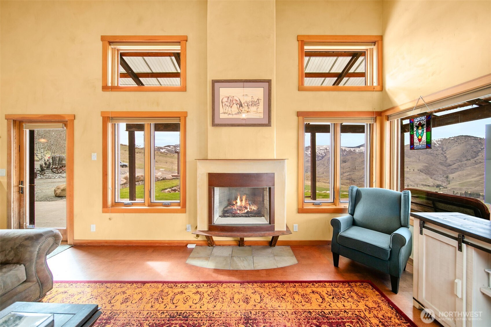 74 Sawtooth View Road Pateros, WA 98846 - Photo 6 of 30 a living room with furniture and a fireplace