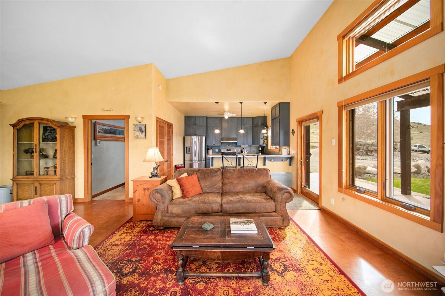 74 Sawtooth View Road Pateros, WA 98846 - Photo 7 of 30 a living room with furniture fireplace and a large window