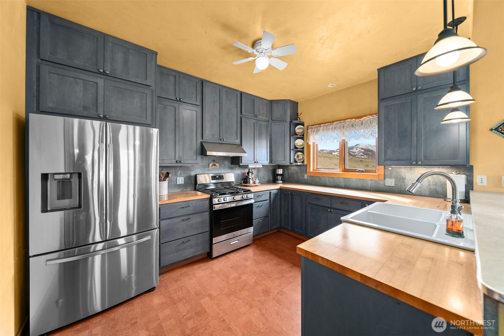 74 Sawtooth View Road Pateros, WA 98846 - Photo 8 of 30 a kitchen with stainless steel appliances granite countertop a refrigerator a sink dishwasher a stove top oven a sink and dishwasher