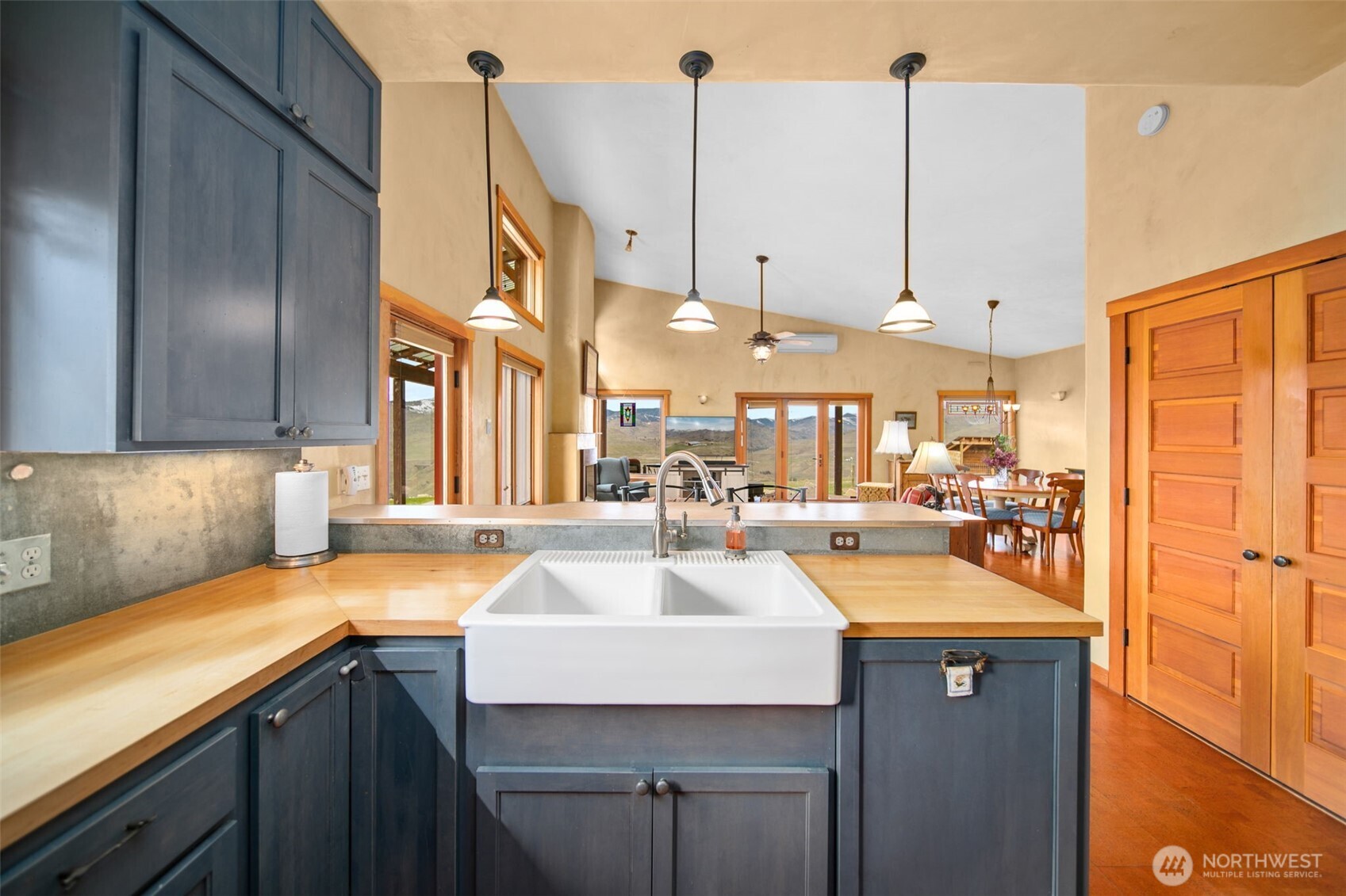 74 Sawtooth View Road Pateros, WA 98846 - Photo 10 of 30 a kitchen with a sink a counter top space and living room view