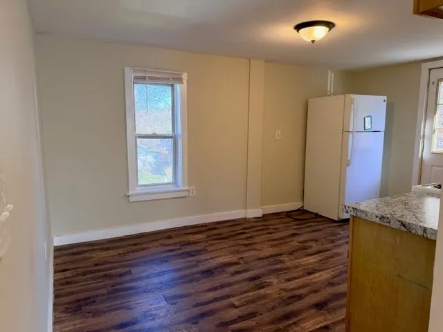 a view of livingroom with hardwood floor and hallway