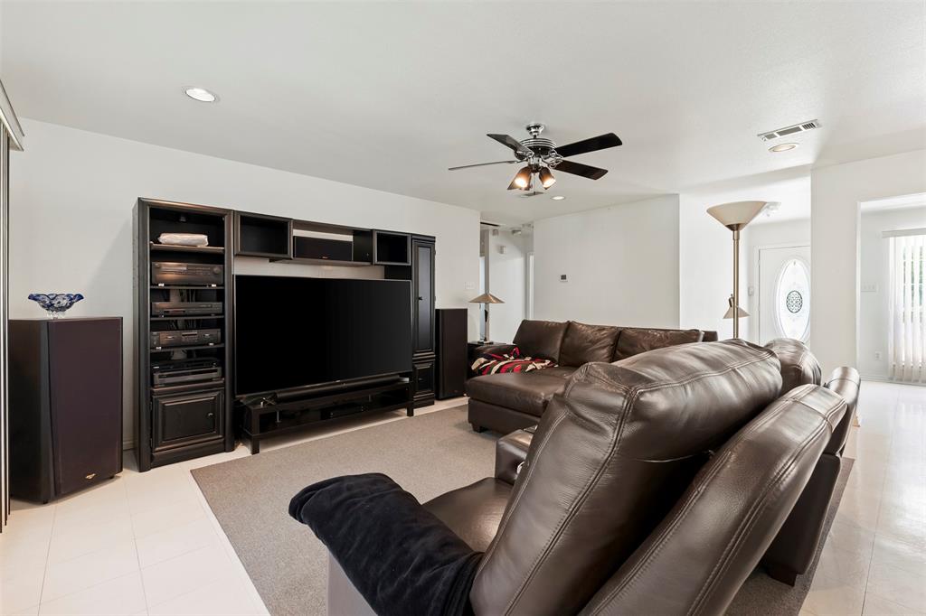 401 Rugged Drive Red Oak, TX 75154 - Photo 15 of 40 Living area with a large media center featuring built-in shelving and cabinetry, recessed lighting, and a ceiling fan