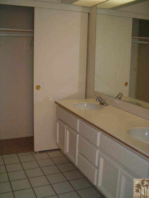 401 El Cielo Road, Unit 29 Palm Springs, CA 92262 - Photo 12 of 25 a bathroom with a sink and a mirror