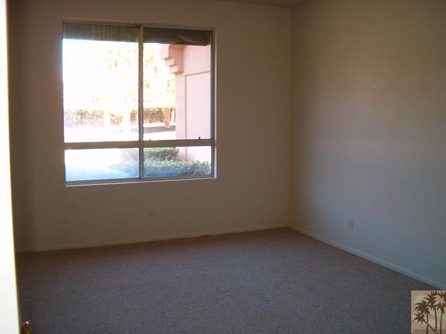 401 El Cielo Road, Unit 29 Palm Springs, CA 92262 - Photo 7 of 25 an empty room with a window