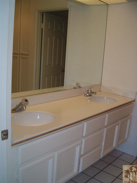 401 El Cielo Road, Unit 29 Palm Springs, CA 92262 - Photo 9 of 25 a bathroom with a sink and a mirror